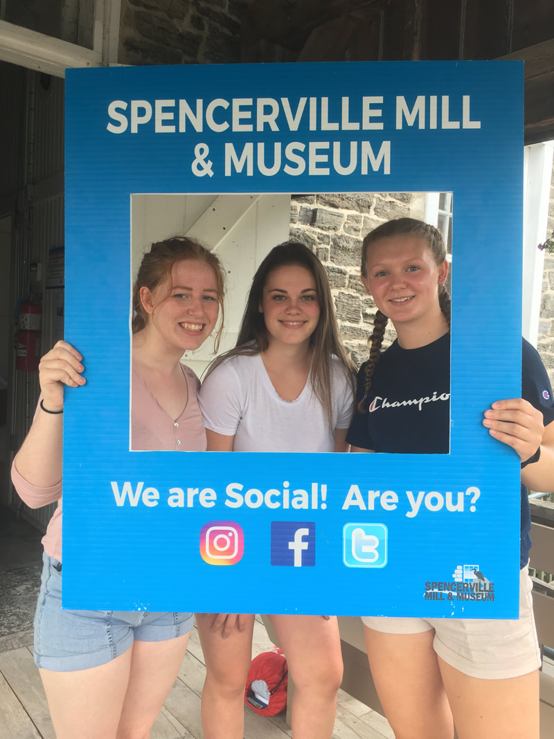 students promoting Spencerville Mill on social media